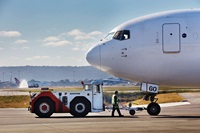 On the airfield image 2 - airplane nose and pushback tug