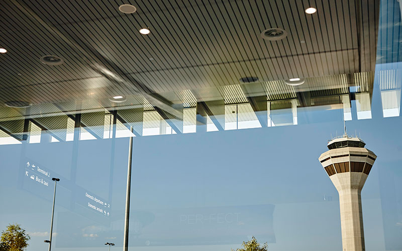 Perth Airport control tower reflected on Terminal 1 glass